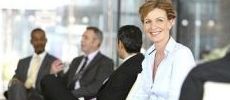 230x100_business_woman_smiling_with_group