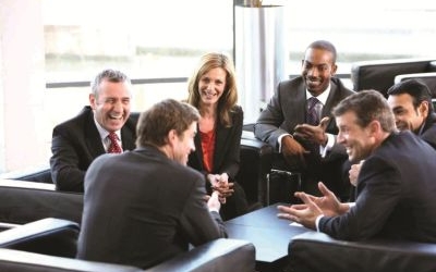 Business people laughing and talking