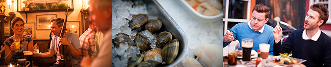 Traditional musicians, tray of fresh cockles, friends eating.