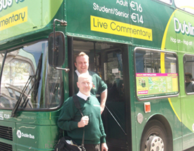 Enjoy a tour bursting with splendid views, amazing visits and incredible history. Bus drivers standing beside their bus in Dublin