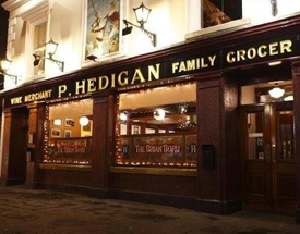 A public house dating back to the 1850s offering a wide range of locally sourced food. Front of Hedigan's pub lit up at night