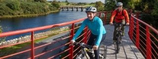 Couple cycling on the Great Western Greenway