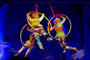 Three people swinging from 