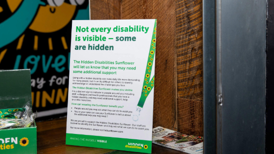 Poster on a desk with text saying not every disability is visible - some are hidden